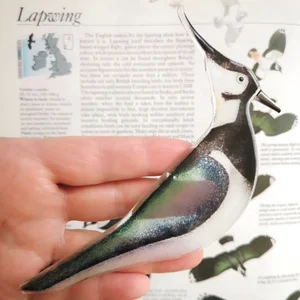 A delicately crafted fused glass Lapwing to enhance any space in